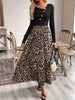 A women's black buckle long-sleeved stitched leopard print pendulum dress, retro casual style thin long skirt