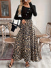 A women's black buckle long-sleeved stitched leopard print pendulum dress, retro casual style thin long skirt