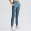 Women Loose Yoga Pants with Stretch Pockets Tapered Fitness Running Casual Jogger Sweatpants Pure Color Jagger Sport Trousers