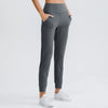 Women Loose Yoga Pants with Stretch Pockets Tapered Fitness Running Casual Jogger Sweatpants Pure Color Jagger Sport Trousers