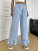 Women’s: versatile checkered, ruffled, straight-leg pants that add a touch of freshness and youthful appeal