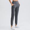 Women Loose Yoga Pants with Stretch Pockets Tapered Fitness Running Casual Jogger Sweatpants Pure Color Jagger Sport Trousers