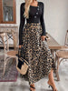 A women's black buckle long-sleeved stitched leopard print pendulum dress, retro casual style thin long skirt