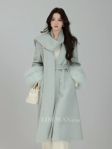 Snow Country's It Girl: Superbly recommended mid-length coat serene sky blue crafted from premium Australian wool. Exudes an air of noble elegance and