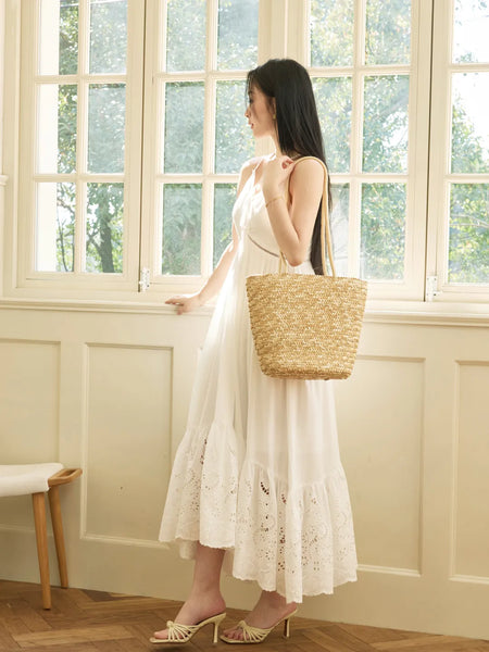 Female guest on a dating show wearing a French-style white sundress pure and innocent made of cotton with embroidery
