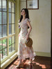 Delicate and charming little woman gentle demeanor wearing a versatile two-way style dress