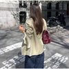 Women's Asymmetrical Blazer with Side Buttons and Ruffle Detail