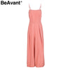 BeAvant Sexy back bow strap women jumpsuit Summer floral print boho beach jumpsuits Backless flare leg jumpsuits rompers
